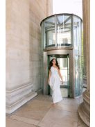 Linda - fehér színű féloldalas matt anyagú maxi ruha masnival