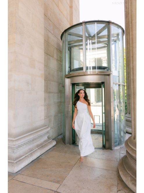 Linda - fehér színű féloldalas matt anyagú maxi ruha masnival